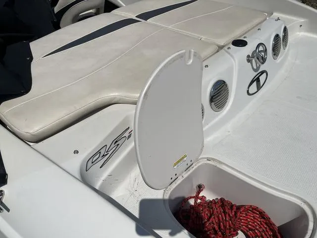 Slide: The Image of 2014 Tahoe Q5i SF boat interior with storage compartment and seating. - 7