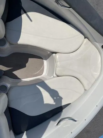 Slide: The Image of 2014 Tahoe Q5i SF boat interior with white cushioned seating. - 9