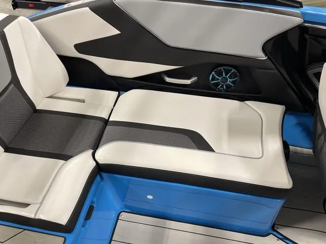 Slide: The Image of 2023 Yamaha Boats 255XD interior seating with modern design and blue accents. - 11