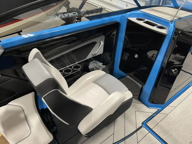 Slide: The Image of 2023 Yamaha Boats 255XD interior with sleek seating and modern design. - 16