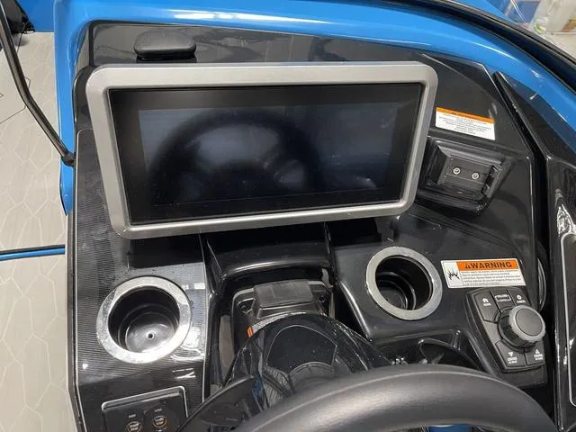 Slide: The Image of 2023 Yamaha Boats 255XD dashboard with touchscreen and controls. - 21