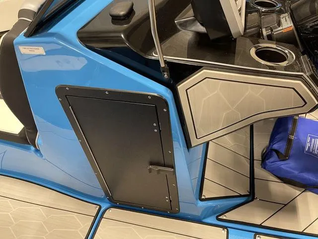 Slide: The Image of 2023 Yamaha Boats 255XD interior, featuring sleek blue design and modern dashboard controls. - 25