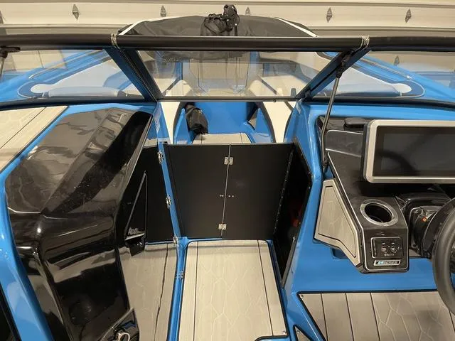 Slide: The Image of 2023 Yamaha Boats 255XD interior with modern dashboard and sleek design. - 27