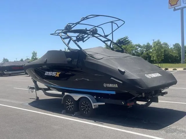 Slide: The Image of 2023 Yamaha Boats 255XD covered on trailer in parking lot. - 3