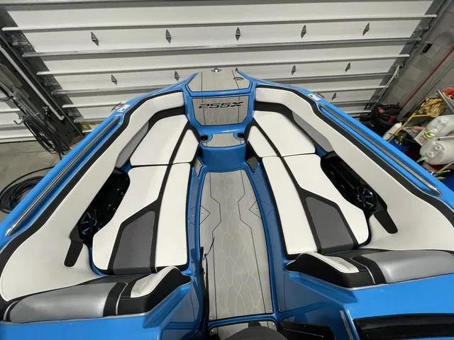 Slide: The Image of 2023 Yamaha Boats 255XD interior with sleek white and black seating. - 32