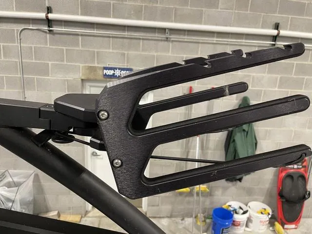 Slide: The Image of Wakeboard rack on 2023 Yamaha Boats 255XD, indoor garage setting. - 37