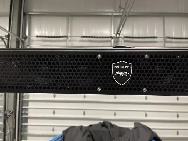 Slide: The Image of Wet Sounds audio system on 2023 Yamaha Boats 255XD in a garage setting. - 39