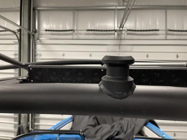 Slide: The Image of Close-up of 2023 Yamaha Boats 255XD component in a garage setting. - 40