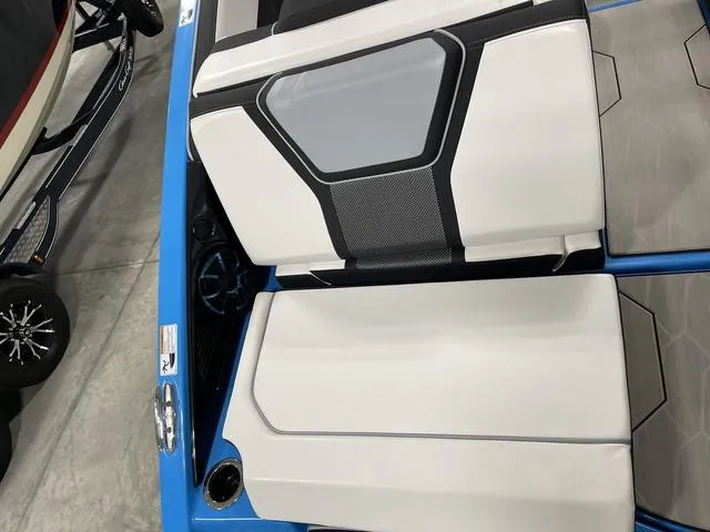 Slide: The Image of 2023 Yamaha Boats 255XD interior seating with modern design and blue accents. - 41