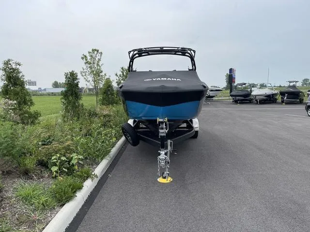 Slide: The Image of 2023 Yamaha Boats 255XD on trailer in parking lot, front view. - 5