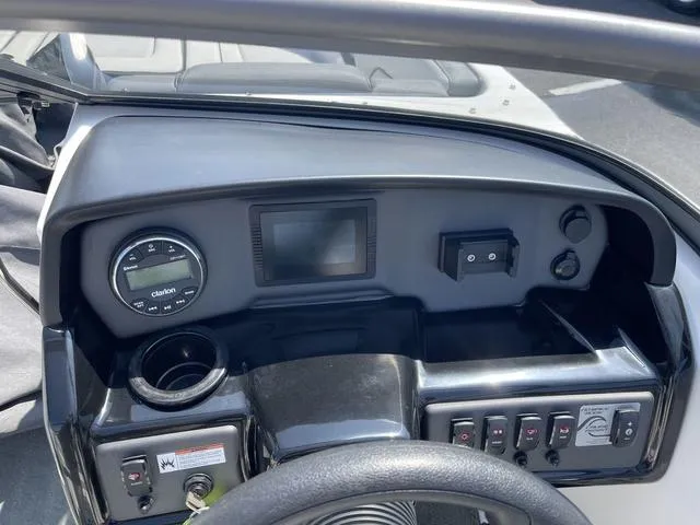 Slide: The Image of 2019 Yamaha SX190 boat dashboard with controls and display. - 12