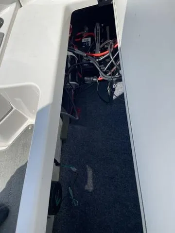 Slide: The Image of 2019 Yamaha SX190 boat interior wiring compartment. - 18