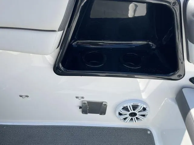 Slide: The Image of 2019 Yamaha SX190 boat interior with cup holders and speaker. - 21