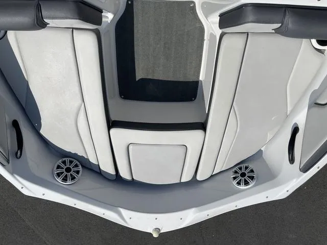 Slide: The Image of 2019 Yamaha Boats SX190 interior with white seating and speakers. - 27