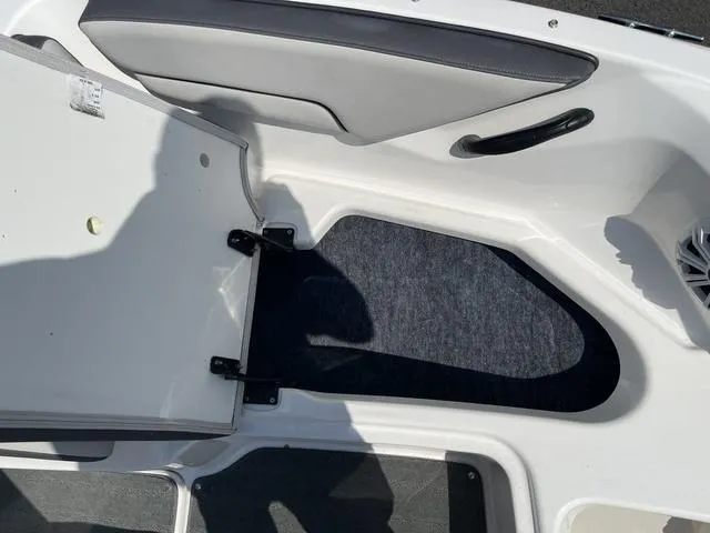 Slide: The Image of 2019 Yamaha SX190 boat interior storage compartment with open hatch. - 28