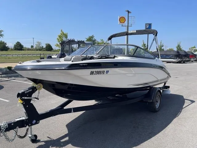 Slide: The Image of 2019 Yamaha SX190 boat on trailer in parking lot, sunny day. - 3