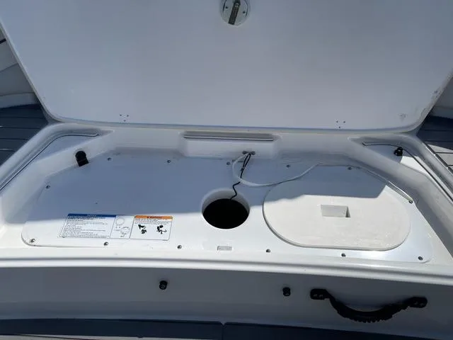 Slide: The Image of Open storage compartment on a 2019 Yamaha SX190 boat. - 9