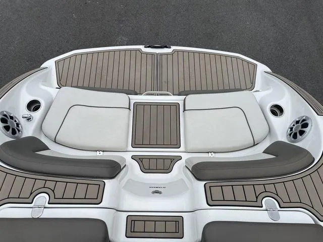 Slide: The Image of 2012 Yamaha Boats 242 Limited S swim platform with cushioned seating and speakers. - 10