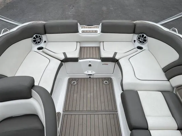 Slide: The Image of 2012 Yamaha Boats 242 Limited S interior with cushioned seating and speakers. - 13