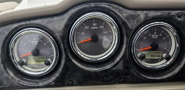 Slide: The Image of 2012 Yamaha Boats 242 Limited S dashboard with steering wheel and control panel. - 15