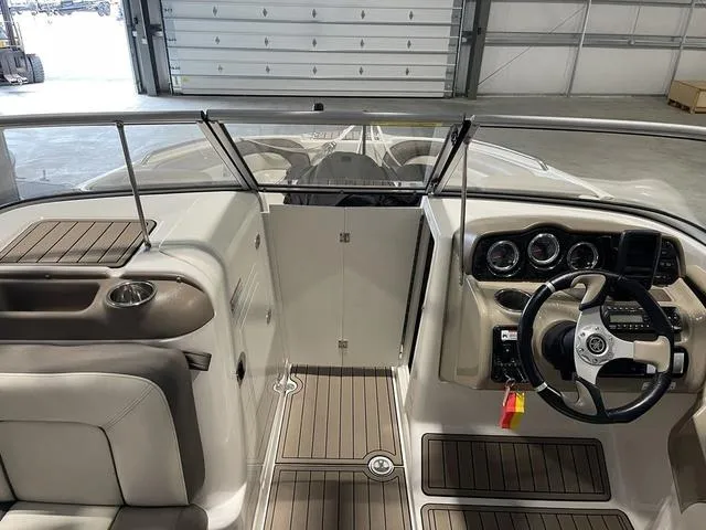 Slide: The Image of 2012 Yamaha Boats 242 Limited S battery compartment with dual batteries. - 18