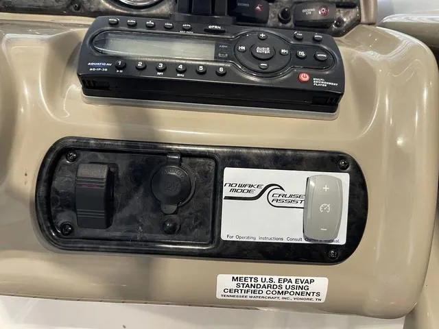 Slide: The Image of 2012 Yamaha Boats 242 Limited S interior with dual consoles and seating. - 20