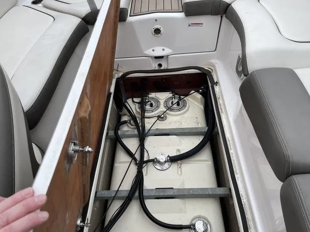 Slide: The Image of Open storage compartment on 2012 Yamaha Boats 242 Limited S. - 23