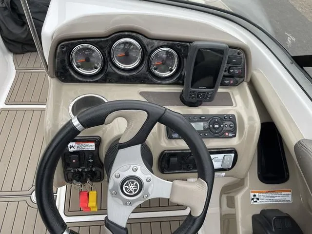 Slide: The Image of Open storage compartment on 2012 Yamaha Boats 242 Limited S. - 25