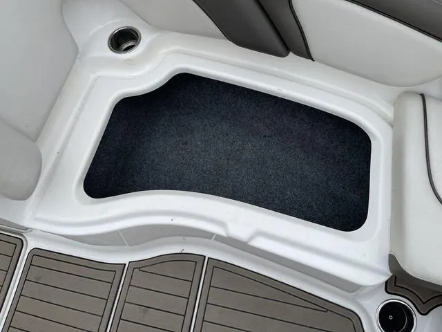 Slide: The Image of Interior view of 2012 Yamaha Boats 242 Limited S, featuring seating and storage area. - 28