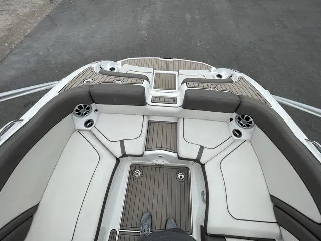 Slide: The Image of 2012 Yamaha Boats 242 Limited S interior with cushioned seating and sleek design. - 33