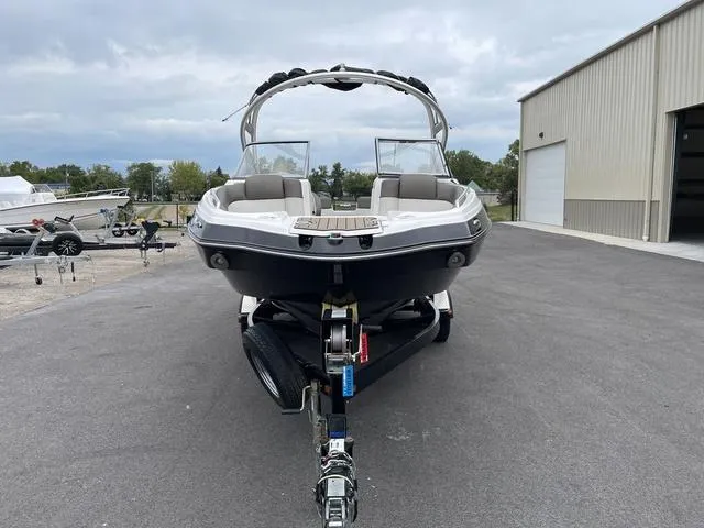 Slide: The Image of 2012 Yamaha Boats 242 Limited S on trailer, parked outside a storage facility. - 5