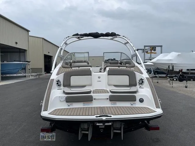 Slide: The Image of 2012 Yamaha Boats 242 Limited S, rear view, parked in marina. - 7
