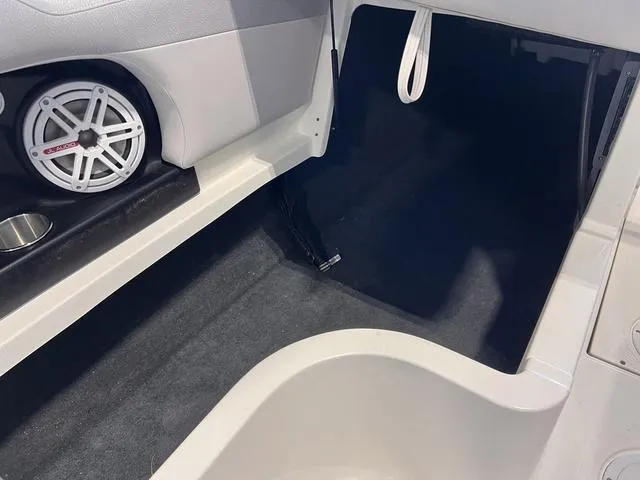 Slide: The Image of 2010 MasterCraft X-Star interior with speaker and storage area. - 11