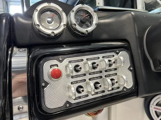 Slide: The Image of 2010 MasterCraft X-Star dashboard with gauges and control panel switches. - 19