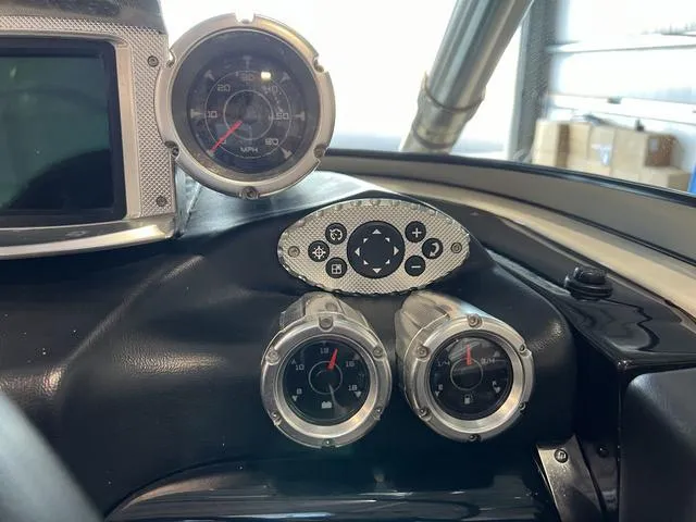 Slide: The Image of Dashboard of a 2010 MasterCraft X-Star boat with gauges and controls. - 21