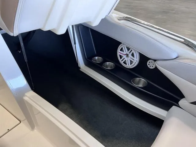 Slide: The Image of 2010 MasterCraft X-Star interior with cup holders and speaker detail. - 26