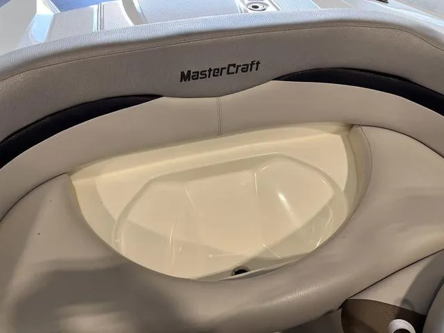 Slide: The Image of MasterCraft X-Star 2010 boat interior with gray and white seating. - 27