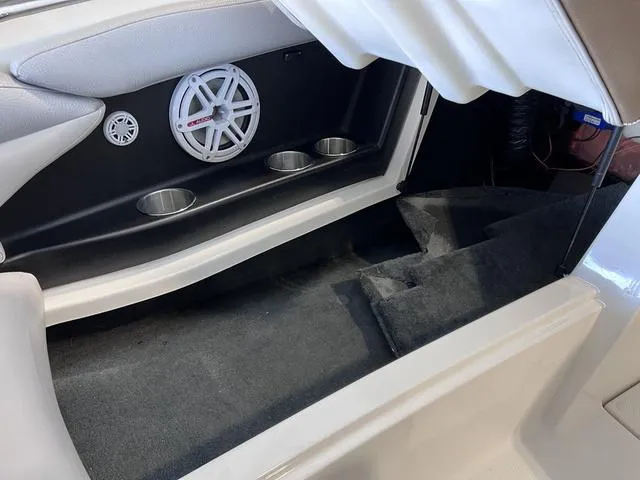 Slide: The Image of 2010 MasterCraft X-Star interior with speaker and cup holders. - 28