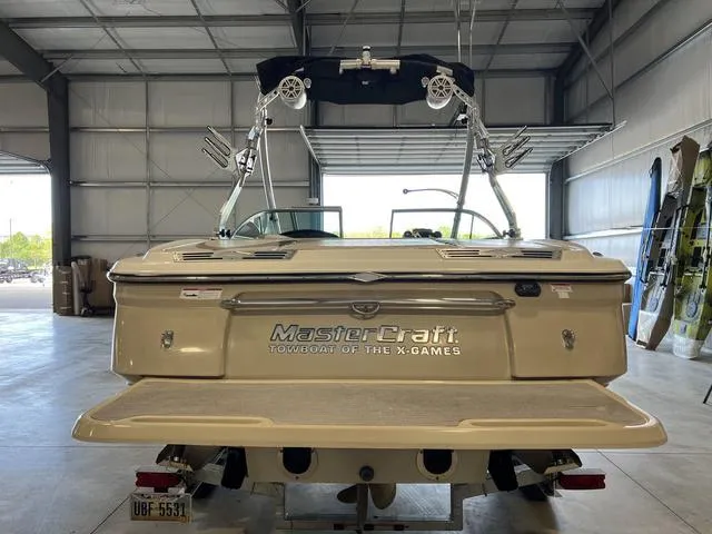 Slide: The Image of 2010 MasterCraft X-Star boat in a garage, rear view. - 3