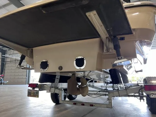 Slide: The Image of 2010 MasterCraft X-Star boat on trailer in garage, rear view. - 30