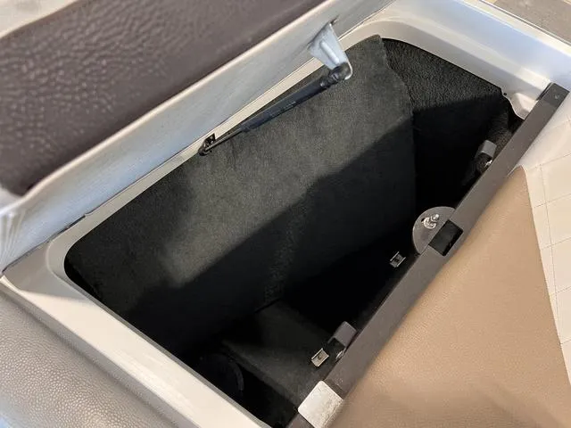 Slide: The Image of Open storage compartment in 2010 MasterCraft X-Star boat interior. - 4