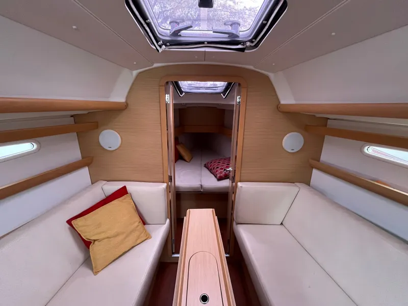 Slide: The Image of Interior of 2012 Beneteau First 30 sailboat with cozy seating and modern design. - 10
