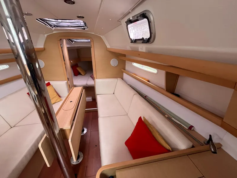 Slide: The Image of Interior of 2012 Beneteau First 30 sailboat with cozy seating and modern design. - 11