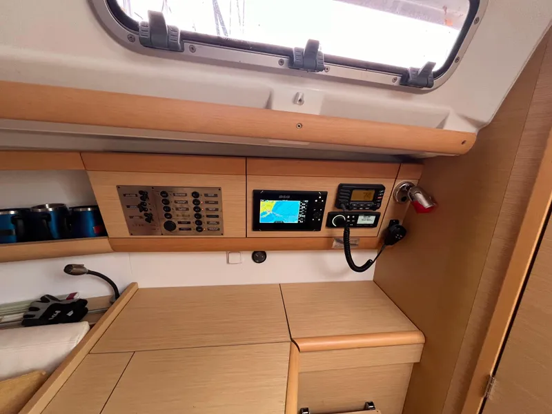 Slide: The Image of Interior of 2012 Beneteau First 30 yacht with navigation equipment and control panel. - 15