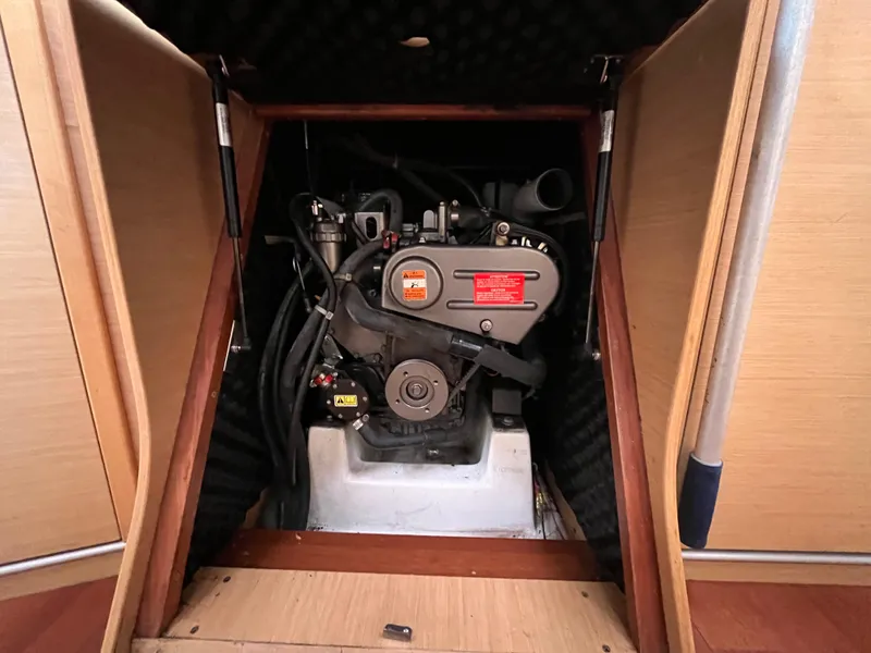Slide: The Image of Engine compartment of a 2012 Beneteau First 30 sailboat, showcasing the engine details. - 23