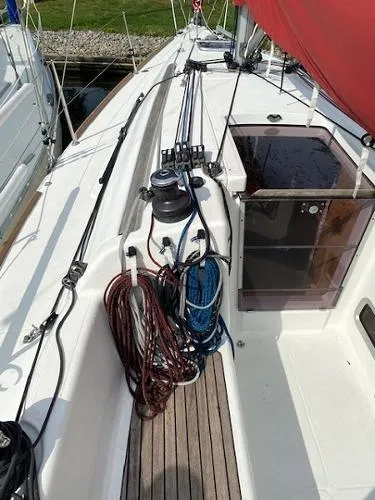 Slide: The Image of 2012 Beneteau First 30 sailboat deck with ropes and winch. - 7