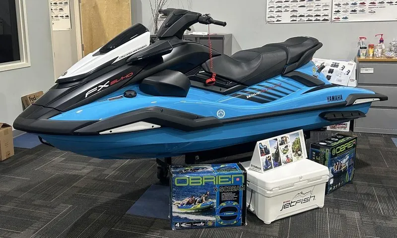 Slide: The Image of 2025 Yamaha WaveRunner FX SVHO® jet ski displayed indoors with accessories. - 1