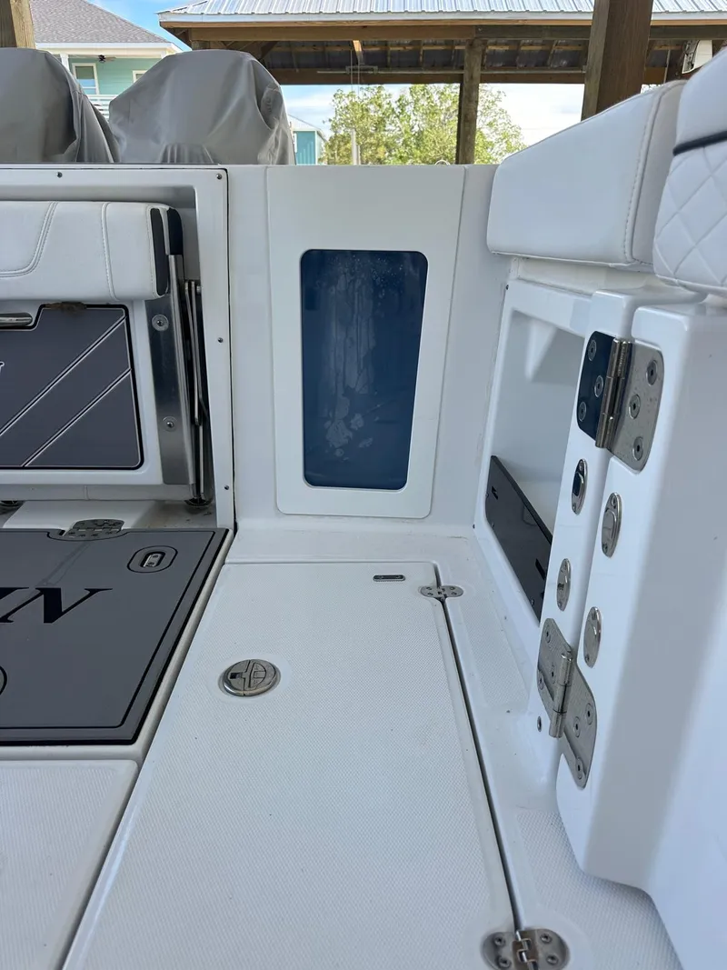 Slide: The Image of 2023 Blackfin 302CC boat interior, featuring sleek white design and modern fittings. - 12