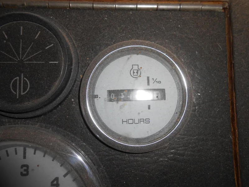 Slide: The Image of Hour meter on 1986 Hanson houseboat dashboard, displaying engine hours. - 14