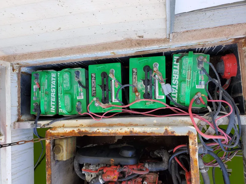 Slide: The Image of Four Interstate batteries connected in a Hanson 1986 houseboat engine compartment. - 9